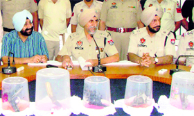 Patiala Senior Superintendent of Police HS Mann shows the illegal weapons siezed in Patiala on Monday.