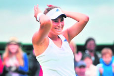 Monica Puig celebrates after beating Sara Errani in the first round on Monday. 