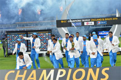 The Indian team celebrates after winning the Champions Trophy. 