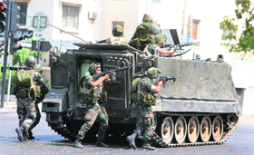 Lebanese soldiers enter the Abra neighbourhood on the outskirts of Sidon on Monday.