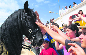 Children pat a horse during the traditional St John festival in Ciutadella on the Balearic Island of Menorca in Spain on Monday.