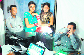 People apply for Aadhaar Cards at a temporary center in Amritsar on Tuesday.
