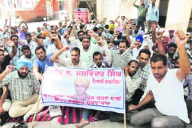 Veterinary pharmacists hold a dharna at the Zila Parishad office in Bathinda on Tuesday