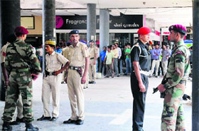 Onlookers gather at a photo lab in Sector 17, Chandigarh, where GOC-in-C, Western Command, Lt-Gen Sanjiv Chachra was getting his pictures clicked on Tuesday.