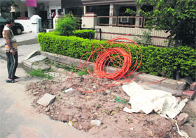 Road left uncarperted after being dug by a private telecom company for laying wires in Sector 10, Panchkula.