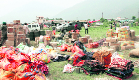 Relief material at the launch pad in Gauchar ready to be transported in helcipters to the affected areas.