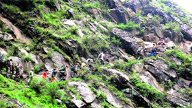 Army men rescue disaster-affected pilgrims in Chamoli district on Tuesday.