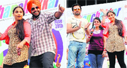 Bollywood actor Vidya Balan dances with a student during the promotion of her upcoming film Ghanchakkar at Lovely Professional University near Jalandhar on Tuesday.  (L) and Bollywood actors Vidya Balan and Emran Hashmi promote their upcoming film Ghanchakkar at Lovely Professional University near Jalandhar on Tuesday