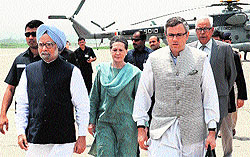 Prime Minister Manmohan Singh and UPA chairperson Sonia Gandhi arrive at the Udhampur Army base station on Tuesday