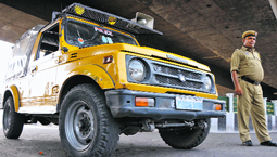 A police patrol vehicle on a busy road.
