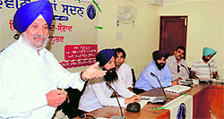 A teacher speaks during a meeting at the Circuit House in Ludhiana