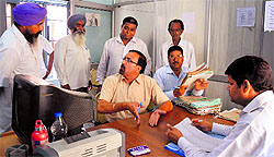 Returning officers check the nomination papers during the scrutiny in Ludhiana on Tuesday