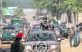 Afghan security forces arrive at the site of the attack in Kabul on Tuesday