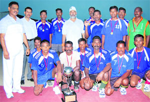 DIG AK Sharma (extreme left), BSF officials and players of the winning team with the trophy in Fazilka on Wednesday. 