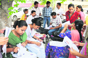 Teachers busy filling forms of students with disabilities to get the same approved by doctors of the departments concerned, as part of a programme under the Sarva Shiksha Abhiyaan. 
