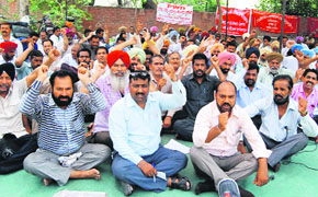Members of the PWD Field and Workshop Union stage a protest in Bathinda on Wednesday.