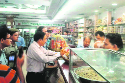 Panchkula SDM RK Singh and other officials take samples from Anupam Sweets in Sector 11, Panchkula, on Wednesday.