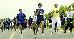 People take part in a run on the occasion of the International Day against Drug Abuse at India Gate in New Delhi on Wednesday