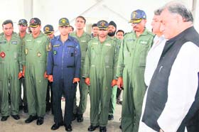 Chief Minister Vijay Bahuguna, along with Air Force personnel, observes a two-minute silence in memory of the chopper crash victims at Jolly Grant Airport on Wednesday