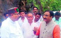 Former Uttarakhand Chief Minister Ramesh Pokhriyal Nishank and Satpal Maharaj, Pauri Garhwal MP, at Paithani village on Wednesday. 