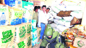 A bomb disposal squad frisks relief boxes in Haridwar on Wednesday. 