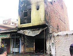 The cloth shop burnt in a fire caused by a short-circuit in Julana town of Jind district on Tuesday night