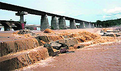 The washed away protection steps of the Chakki railway bridge on the Pathankot-Jogindernagar rail line