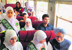 Prime Minister Manmohan Singh and UPA chairperson Sonia Gandhi along with schoolgirls on the train that was flagged off from Banihal to Qazigund on Wednesday.  PTI