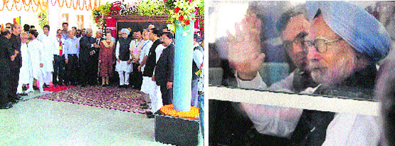 Prime Minister Manmohan Singh and UPA chairperson Sonia Gandhi with other dignitaries after inaugurating the Banihal-Qazigund rail link in Banihal on Wednesday; and (right) the Prime Minister waves to the public from the train. A Tribune photograph/PTI