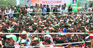 A crowd watches them during the inauguration of the Qazigund-Banihal railway line on Wednesday.