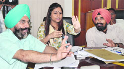 MC officials conduct an auction of parking sites at its Zone D office in Ludhiana on Wednesday. Photo: Inderjeet Verma
