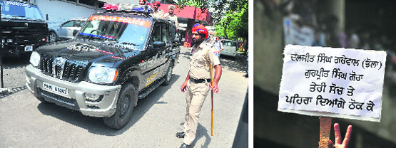 Councillor Daljit Singh Grewal being produced at the District Courts complex in Ludhiana; and (right) a supporter holds a placard in Grewal’s support. Tribune Photos: Himanshu Mahajan