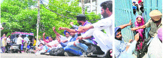 Parents protest on a road outside RS Model School in Ludhiana; and (below) a security man tries to stop relatives of candidates appearing for the CET at the school. tribune photos
