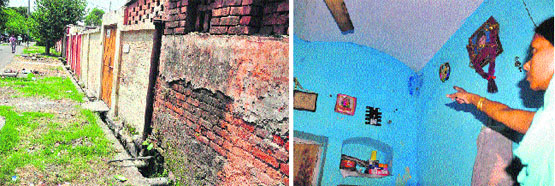 Houses at the Railway Colony in poor shape; and (right) a woman shows a damp corner wall of her quarters at the colony. Tribune photos: Himanshu Mahajan