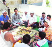 Residents perform a havan at Ahmedgarh on Wednesday. A Tribune photograph