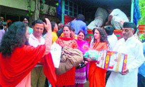Dr Navjot Kaur Sidhu, Chief Parliamentary Secretary (third from left), helps in unloading relief material at Rishikesh on Wednesday. 