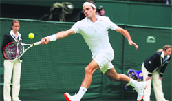 Colour Code: Roger Federer has been asked to change his orange-soled shoes.  Reuters 