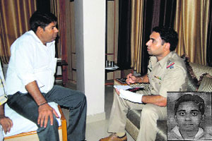 Kotwali Station House Officer (SHO) Karamjit Singh records statements of the employees of the hotel where a marketing executive  (inset) was found dead under mysterious circumstances, in Bathinda on Thursday. 