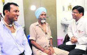 Dr Surinder Singh (right) with two cancer patients at the GMCH-32 in Chandigarh