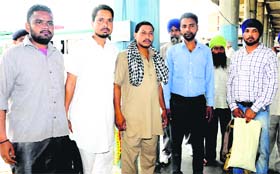 A group of Kajehri residents at the Sector 43 ISBT after returning safely from Badrinath on Thursday