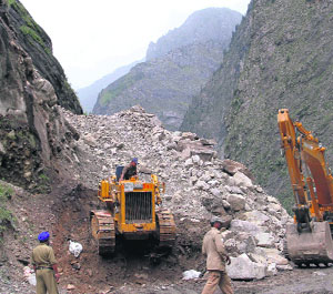 BRO men at work to repair a road near Gobind Ghat in Chamoli on Thursday. 