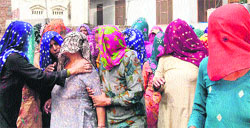 Wailing women members of the bereaved families at Chausala village in Kaithal district on Thursday. Tribune photo