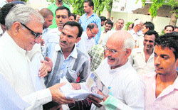 Chief Minister Bhupinder Singh Hooda accepts representations from people in Sonepat on Thursday. Tribune photo