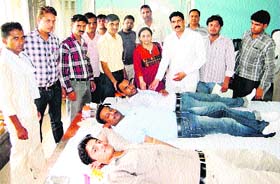Sub-Inspector Ashok Kumar Verma (third from right) of the Kurukshetra police inspires blood donors at the 18th voluntary blood donation camp held on the premises of Police Lines