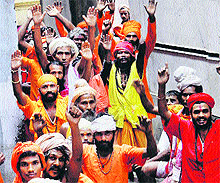 Sadhus wait to register themselves for the Amarnath yatra, in Jammu on Thursday