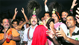 Devotees sing religious songs in Jammu on Thursday.