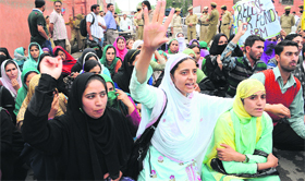 Teachers engaged under Saakshar Bharat Mission protest in Srinagar on Thursday.
