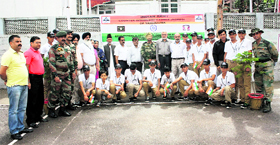 Brigadier NR Indurkar along with students and officials before the flag-off ceremony at Poonch.