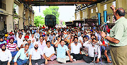 Railway employees hold a protest in Ludhiana