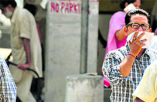 an attendant covers his nose at the Civi Hospital in Ludhiana